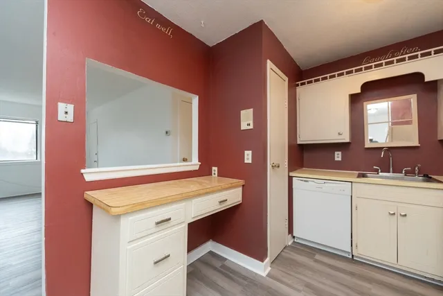 a bathroom with a sink vanity and a mirror