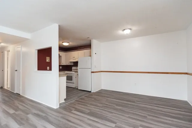 a view of kitchen with cabinets and wooden floor