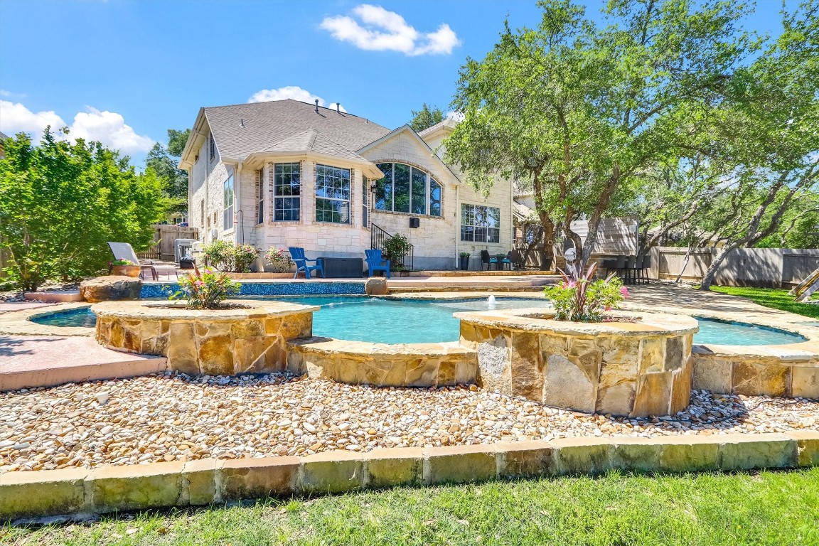 3427 Cowden Drive Austin, TX 78732 - Photo 1 of 1 a front view of a house with swimming pool