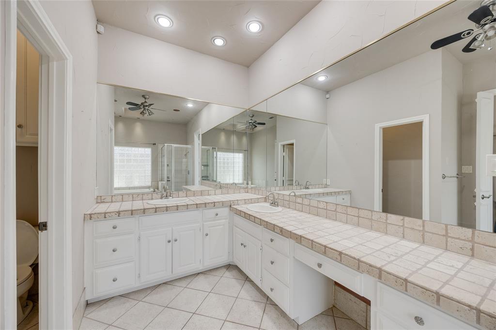 1201 Findlay Drive Arlington, TX 76012 - Photo 21 of 35 a spacious bathroom with a granite countertop sink mirror and double