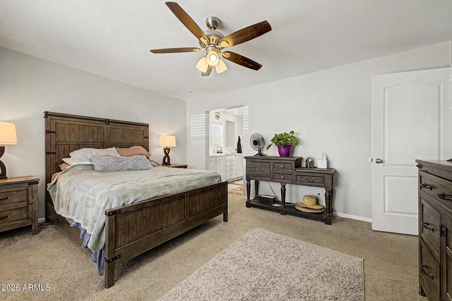 22417 West Dove Valley Road Wittmann, AZ 85361 - Photo 17 of 53 a bedroom with a bed and a table