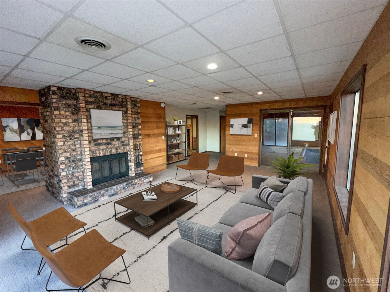 1303 Nightingale Road Wapato, WA 98951 - Photo 16 of 32 a living room with furniture a flat screen tv and a floor to ceiling window