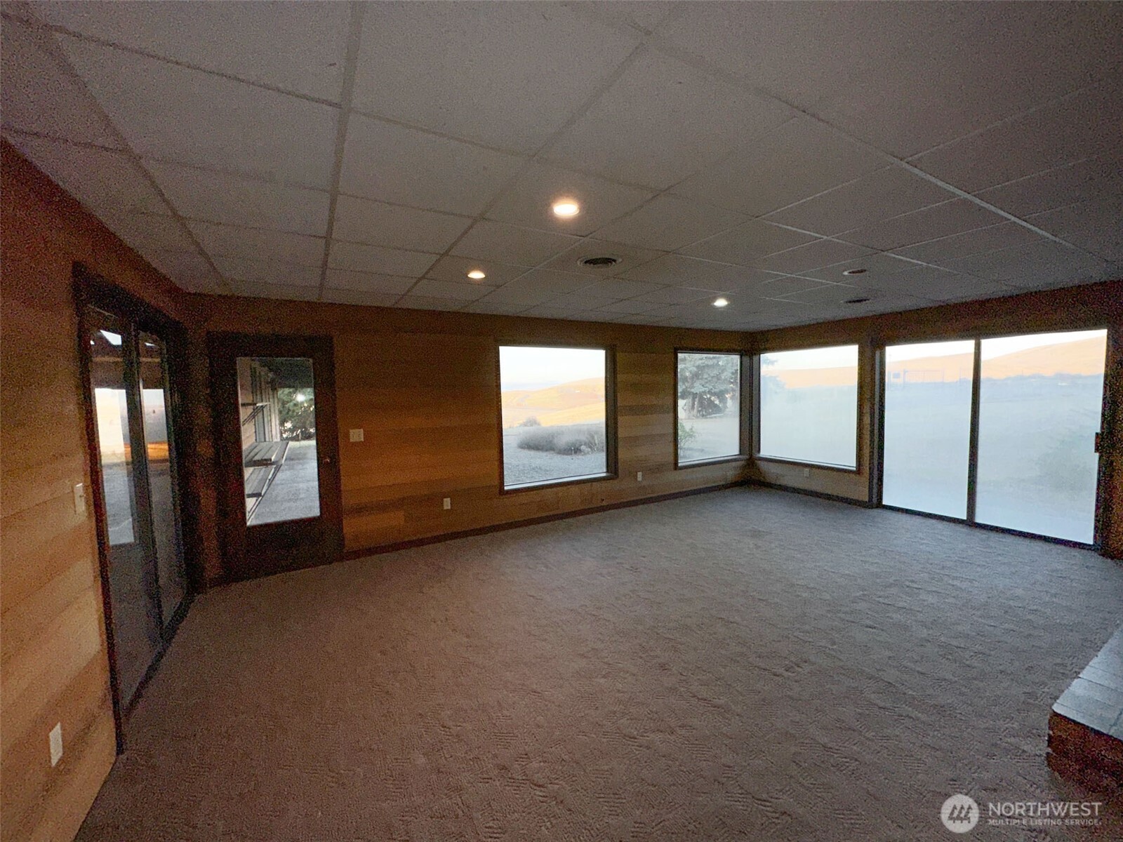 1303 Nightingale Road Wapato, WA 98951 - Photo 21 of 32 a view of an empty room with a window and balcony