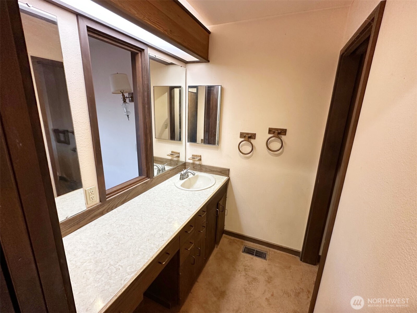 1303 Nightingale Road Wapato, WA 98951 - Photo 25 of 32 a bathroom with a sink a mirror and a shower