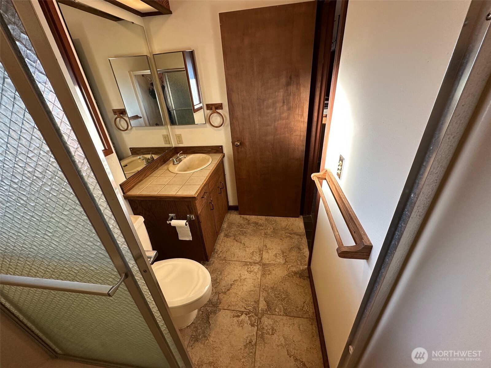 1303 Nightingale Road Wapato, WA 98951 - Photo 28 of 32 a bathroom with a sink a mirror and toilet