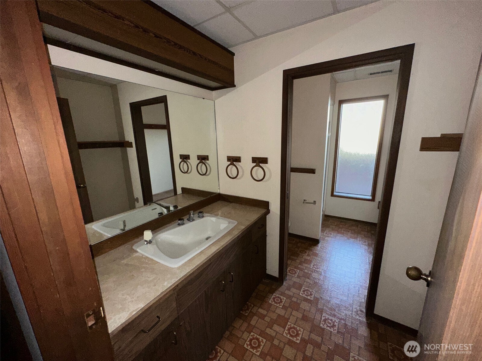 1303 Nightingale Road Wapato, WA 98951 - Photo 31 of 32 a bathroom with a granite countertop sink toilet and mirror