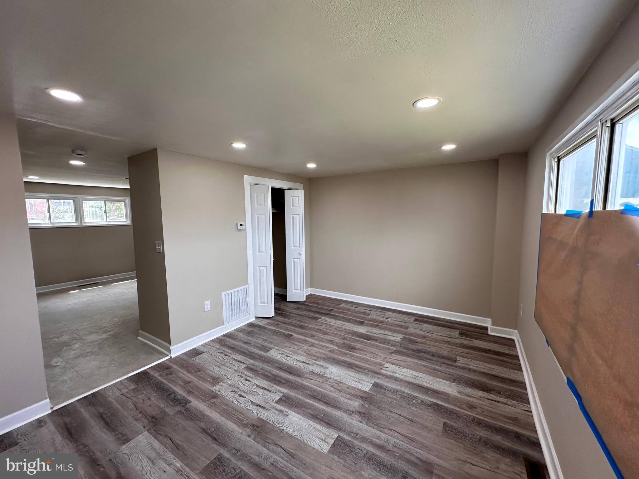 8039 Gough Street Baltimore, MD 21224 - Photo 3 of 17 a view of hallway with wooden floor