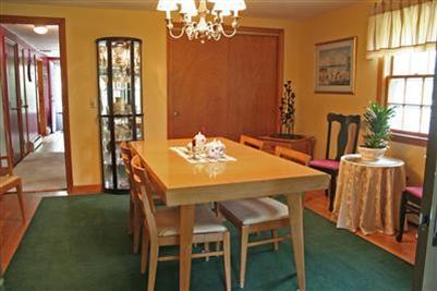 157 Poponessett Road Cotuit, MA 02635 - Photo 15 of 25 a dining room with furniture and window