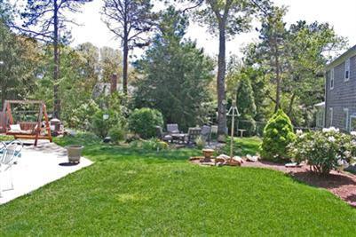 157 Poponessett Road Cotuit, MA 02635 - Photo 16 of 25 a view of a park with large trees