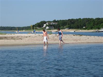 157 Poponessett Road Cotuit, MA 02635 - Photo 21 of 25 a view of a lake with a yard
