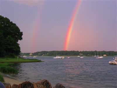 157 Poponessett Road Cotuit, MA 02635 - Photo 23 of 25 a view of a lake and a mountain