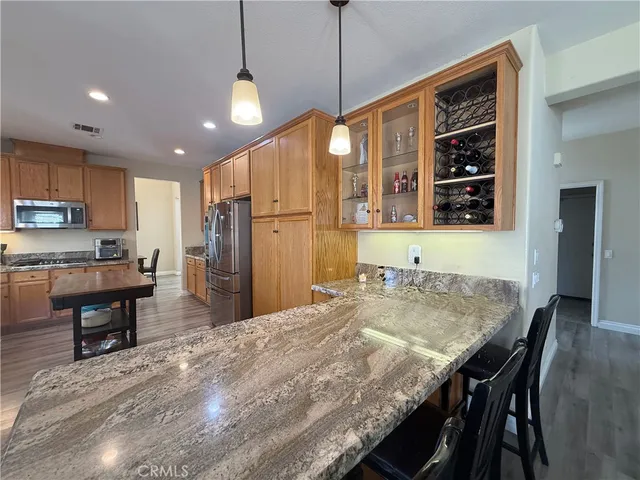 a kitchen with a table and chairs in it