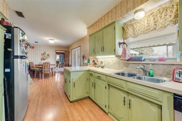 a kitchen with lots of counter top space and dining table