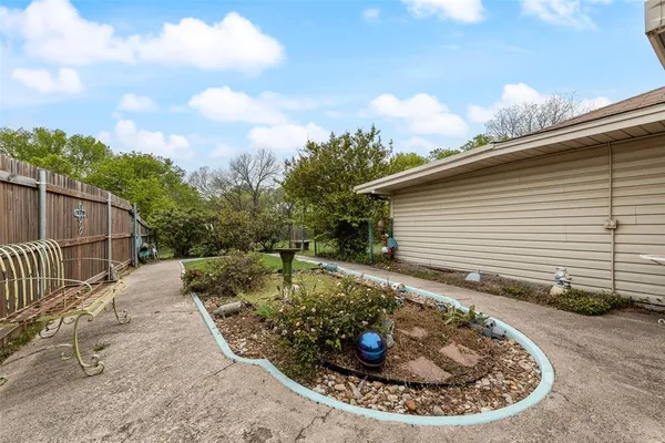 a front view of a house with a yard table and chairs