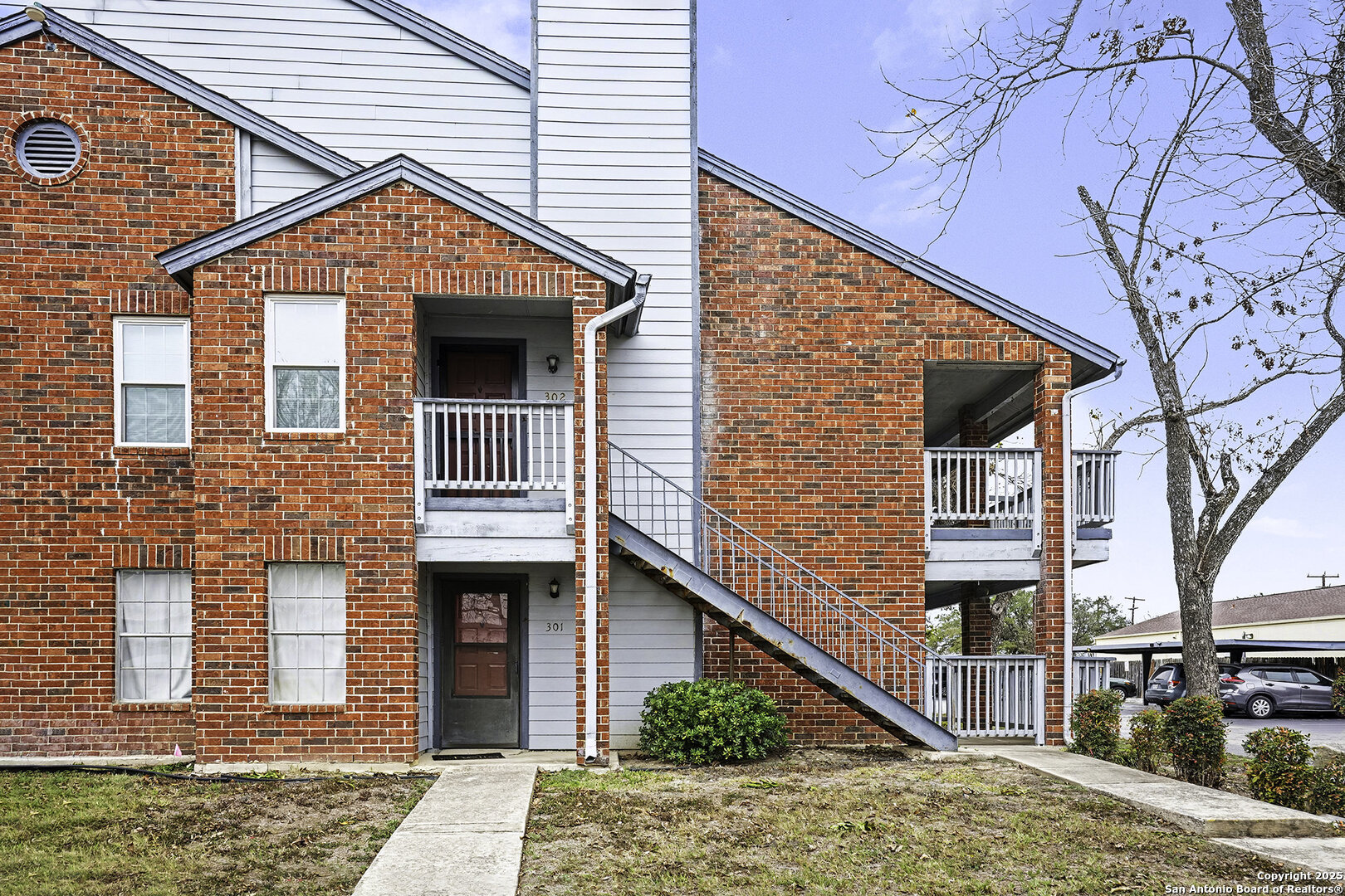 a front view of a house with garage