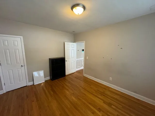 a view of an empty room and a window