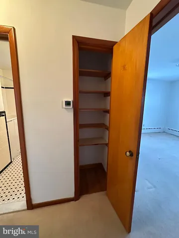 a view of an empty room with a window