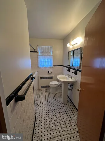 a bathroom with a sink and a shower