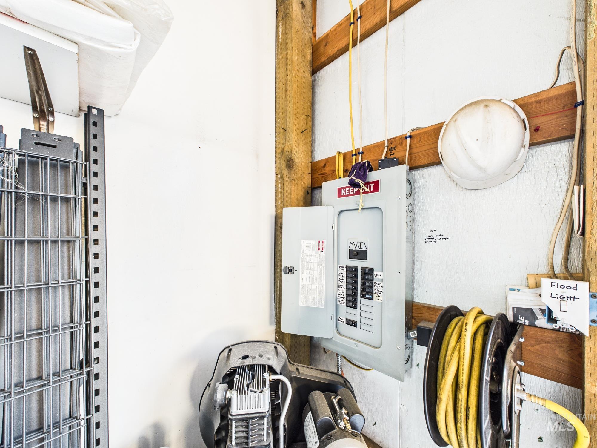 3422 6th Street Lewiston, ID 83501 - Photo 39 of 43 Interior utility space featuring an exposed electrical panel and wooden structural beams