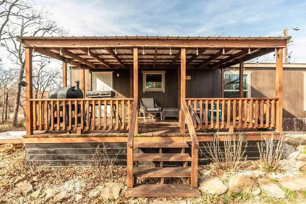 front view of a house with a wooden fence