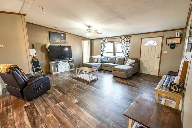 a living room with furniture and a flat screen tv