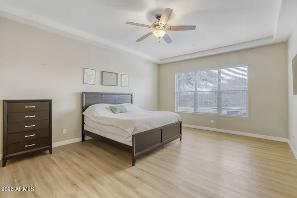 a room with furniture pool table and wall paintings