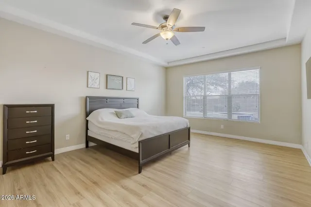 a front view of a house with swimming pool having outdoor seating