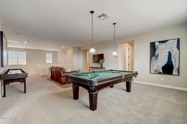 a room that has a bed and a dresser in it