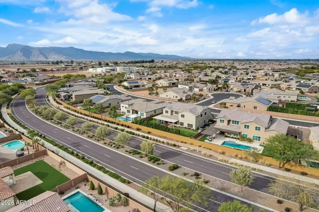 a room with patio furniture and a floor to ceiling window