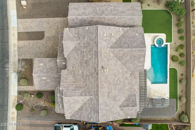 a view of roof deck with couches and potted plants