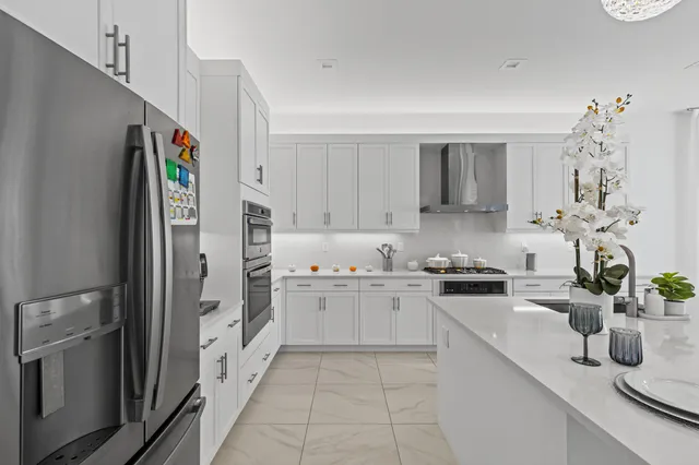 a living room with furniture and a painting on the wall