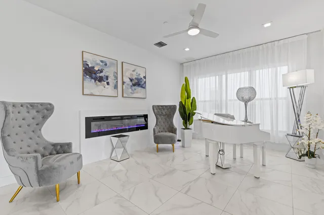 a bedroom with a bed and a ceiling fan