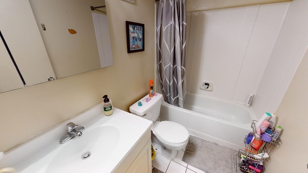 108 Peterborough Street, Unit 3E Boston, MA 02215 - Photo 11 of 11 a bathroom with a sink toilet and bathtub