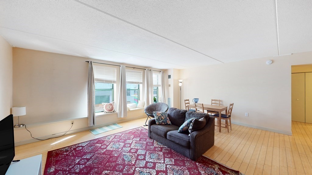 108 Peterborough Street, Unit 3E Boston, MA 02215 - Photo 2 of 11 a living room with furniture and a couch