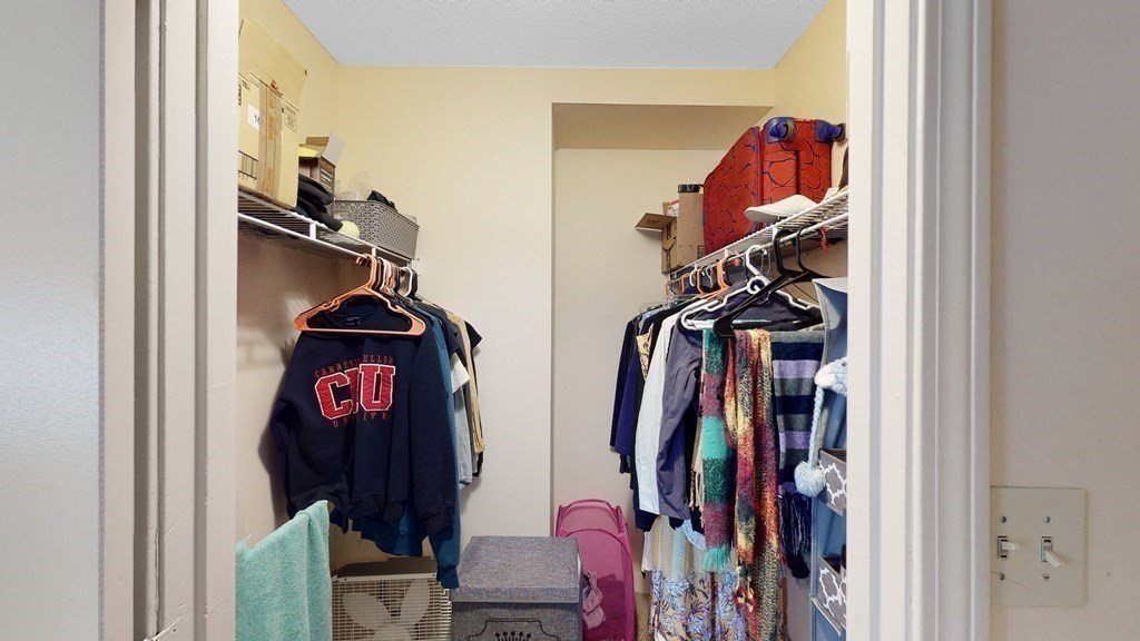 108 Peterborough Street, Unit 3E Boston, MA 02215 - Photo 6 of 11 a view of walk in closet with clothes and shoes