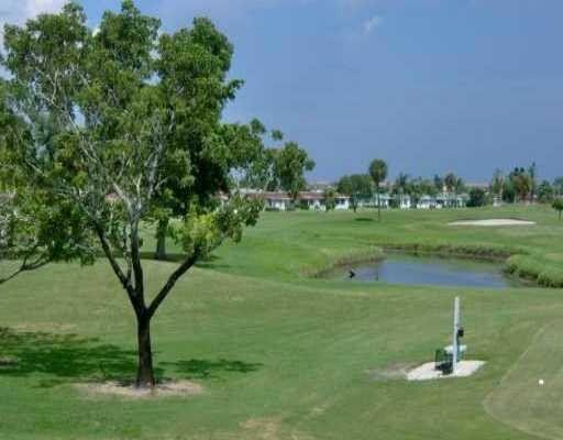 283 Saxony Circle, Unit 283 Delray Beach, FL 33446 - Photo 16 of 19 a view of a golf course with a garden