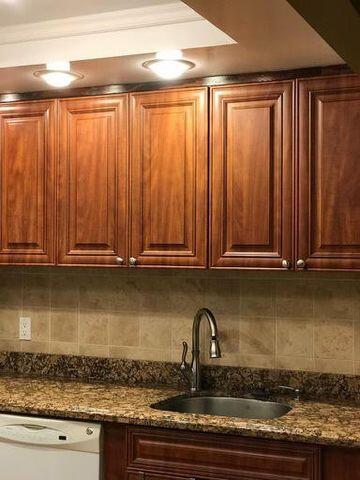 283 Saxony Circle, Unit 283 Delray Beach, FL 33446 - Photo 3 of 19 a close view of a sink and a microwave