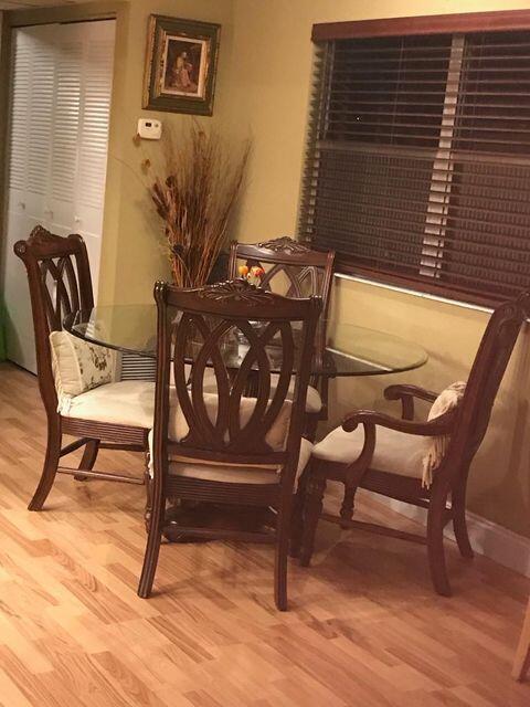 283 Saxony Circle, Unit 283 Delray Beach, FL 33446 - Photo 4 of 19 a view of a chairs and table in the balcony