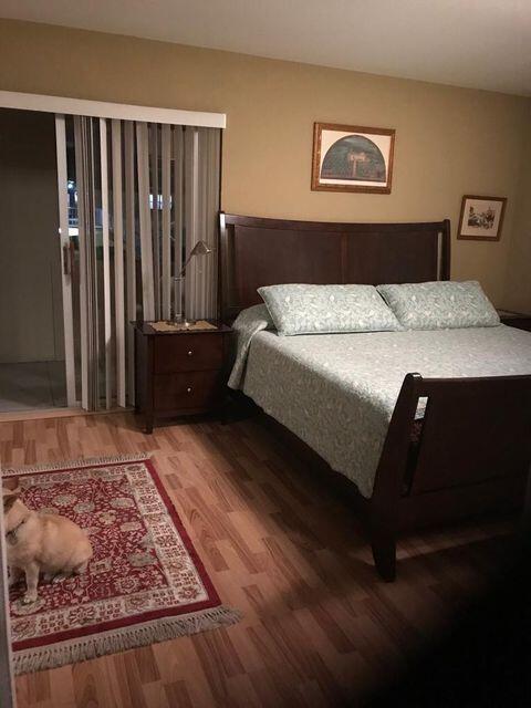 283 Saxony Circle, Unit 283 Delray Beach, FL 33446 - Photo 7 of 19 a bedroom with a bed and a window