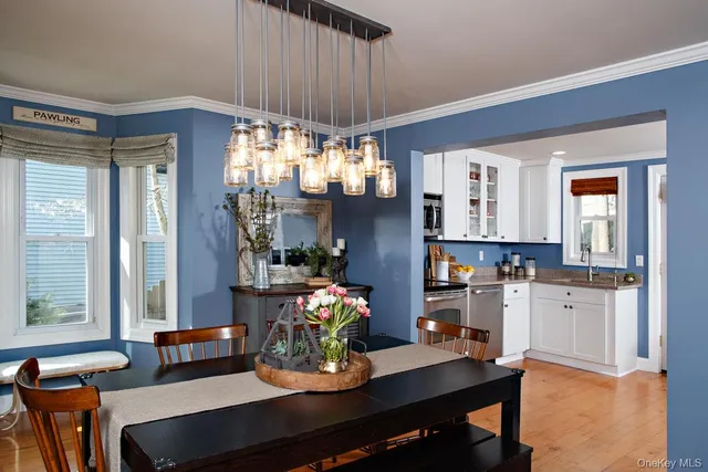 a dining room with furniture and window