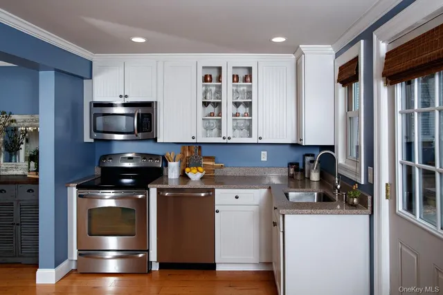 a kitchen with a stove and a microwave