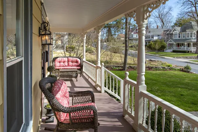 a view of a balcony with chairs