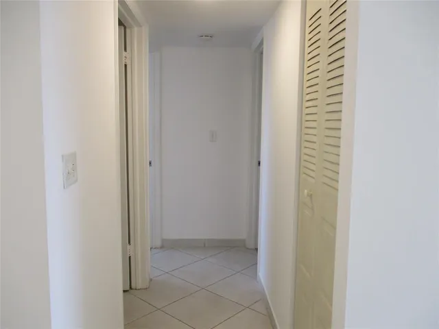 a view of a hallway with closet