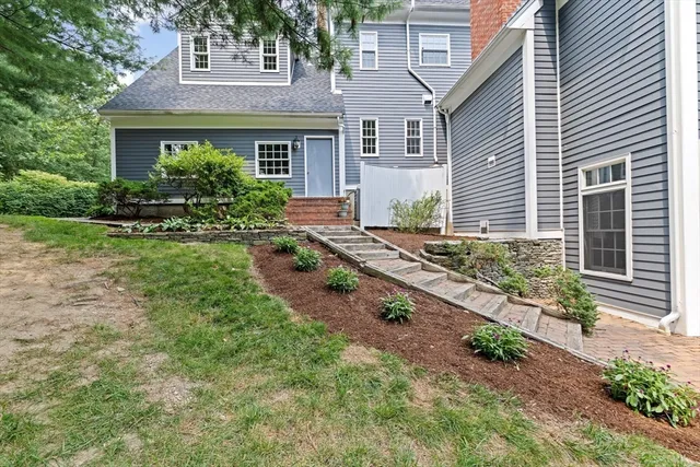 a front view of a house with garden