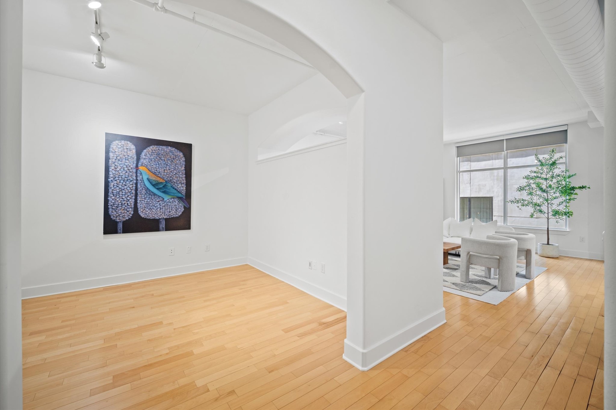 1901 Post Oak Boulevard, Unit 204 Houston, TX 77056 - Photo 14 of 36 The entry frames a private study on one side and an open light-filled living space on the other, creating a beautiful balance between function, flow, and elevated urban living.