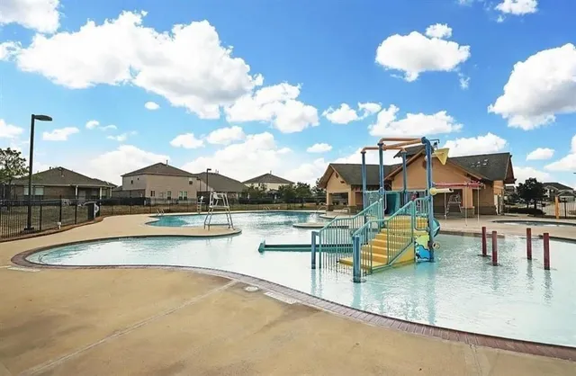 a view of a swimming pool with a lounge chairs