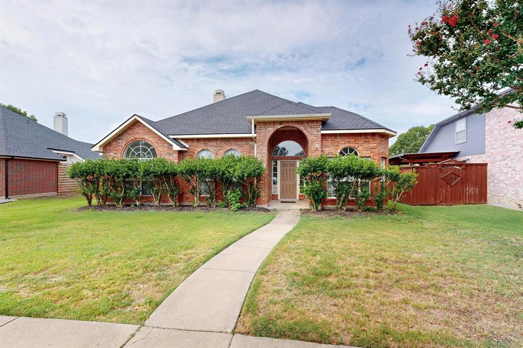 911 Morningside Lane Allen, TX 75002 - Photo 1 of 1 a front view of a house with garden