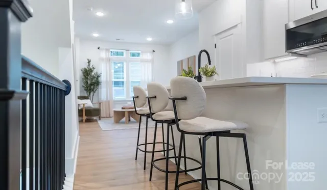a kitchen with a stove and a microwave