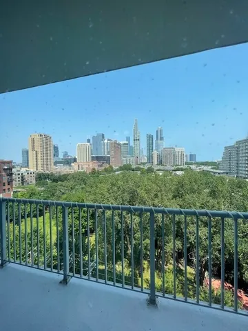 a view of a balcony with city