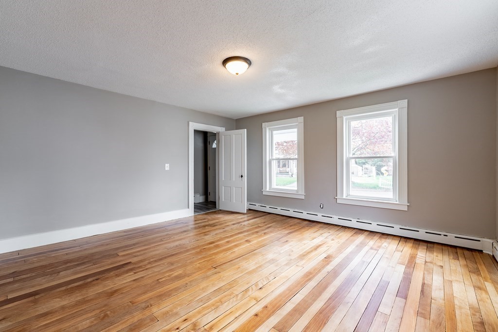 37 North Street Three Rivers, MA 01080 - Photo 15 of 35 a view of an empty room with wooden floor and a window